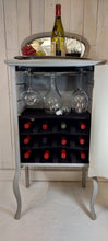 Load image into Gallery viewer, Larkin Sheet Music Wine Cabinet frontal view  open door with props
