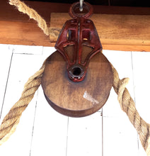 Load image into Gallery viewer, Close-up view of barn pulley supporting hanging barn shade lights.
