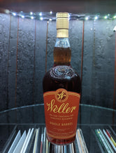 Load image into Gallery viewer, Open door view of whiskey barrel displaying customer&#39;s Bottle of Weller&#39;s Single Barrel Bourbon.  Illuminated by white light and showing record albums below round glass shelf.
