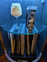 Load image into Gallery viewer, Open door view of whiskey barrel displaying customer&#39;s glass and can of Troon beer.  Illuminated by blue hue light and showing record albums below round glass shelf.
