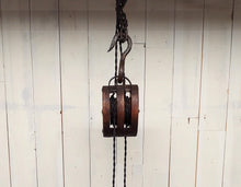 Load image into Gallery viewer, Close-up of double wheel barn pulley used to hand dual cage lights.
