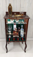 Load image into Gallery viewer, Larkin open-faced music cabinet with hunter green beadboard back panel.  Displays wine and liquor bottles and staged shaker and whiskey glass.
