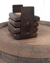 Load image into Gallery viewer, Four whiskey barrel stave coasters in barrel ring holder.
